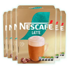 Pouring sachet into mug with hot water for smooth latte