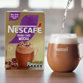 Cup showing creamy foam from NESCAFÉ MOCHA Double Choco.