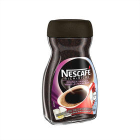 NESCAFÉ Rich French Vanilla cup with spoon emphasizes smooth, vanilla-infused flavor for instant enjoyment.