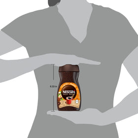 NESCAFÉ Rich Hazelnut mug with creamy foam, ideal for cozy mornings.