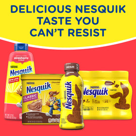 Nesquik Strawberry Powder being poured into a glass of milk.