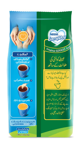 Nestle Everyday Milk Powder being stirred into hot tea for a smooth cup.