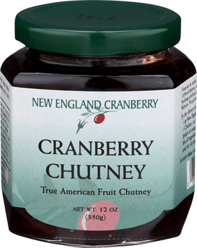 New England Cranberry Chutney jar on a cheese board with cheddar