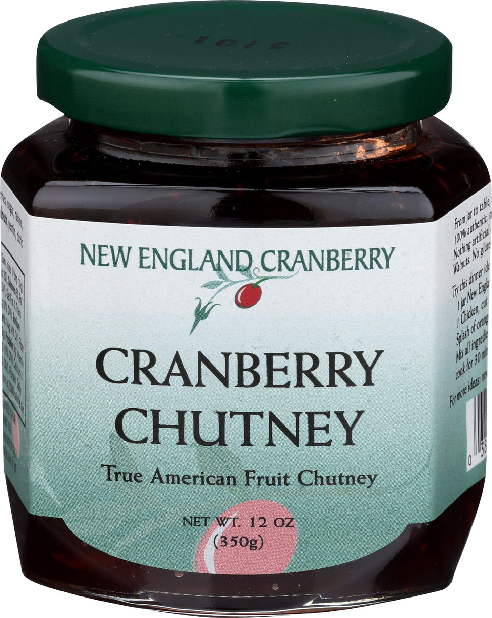 New England Cranberry Chutney jar on a cheese board with cheddar