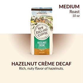 New England Hazelnut Creme Decaf ground coffee 10oz bag highlights smooth, nutty aroma ready for morning brew.