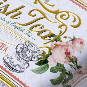 New English Teas English Rose Tea Tin beside a steaming cup ready to brew.