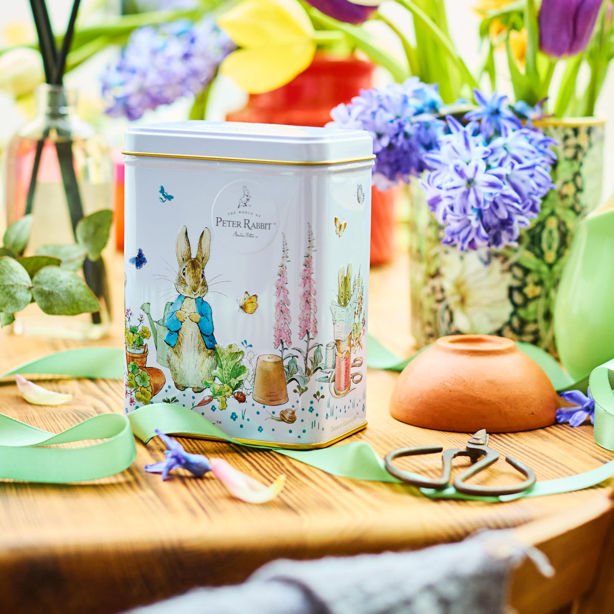 New English Teas Peter Rabbit Tea Tin on shelf enriches home decor.