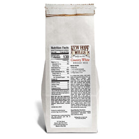 New Hope Mills Country White Bread Mix dough closeup showing soft crumb ready for slicing.