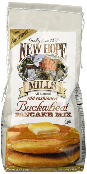 New Hope Mills Buckwheat Pancake Mix being poured for fluffy breakfast.