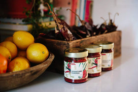 New York Shuk Signature Harissa on a burger adding depth and heat.