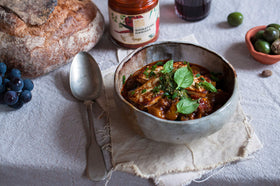 New York Shuk Signature Harissa in a simmering pot for flavorful meals.