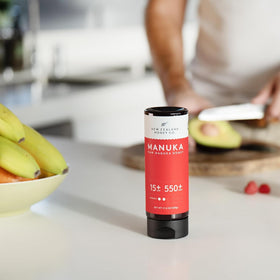 New Zealand Honey Co Manuka UMF 15+ bottle pouring over toast