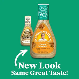 Newman's Own Honey Mustard Dressing pouring from a glass bottle for versatile use.