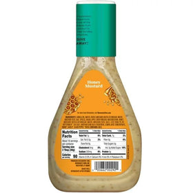 Premium Newman's Own Honey Mustard Dressing in a clear glass bottle on display.