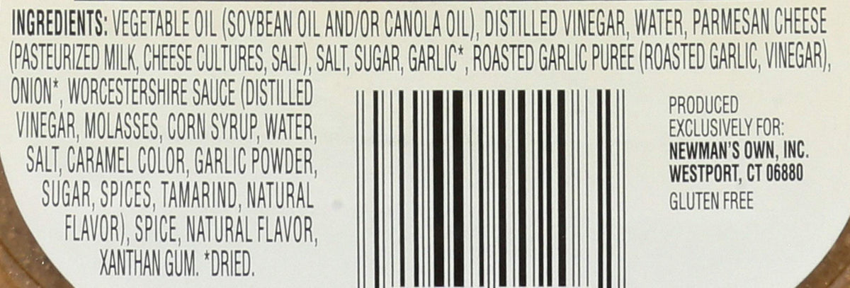Creamy texture of Newman's Own Parmesan & Roasted Garlic dressing drizzled over greens.