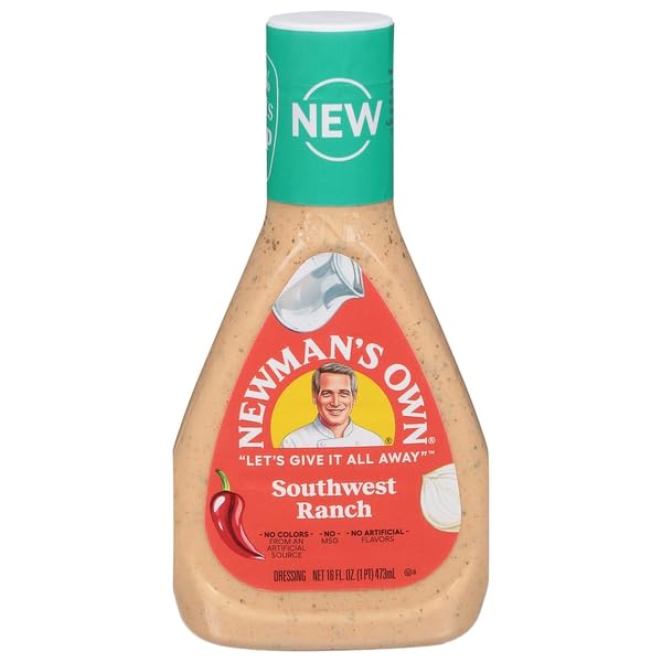Newman's Own Southwest Ranch dressing bottle pour enhances salads with creamy flavor.