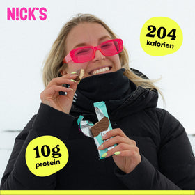 Nick's wafer bar cross-section shows creamy peanut butter and crisp layers.