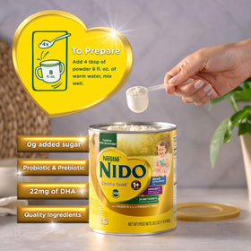 Nido Excella Gold being mixed with warm water for a creamy drink