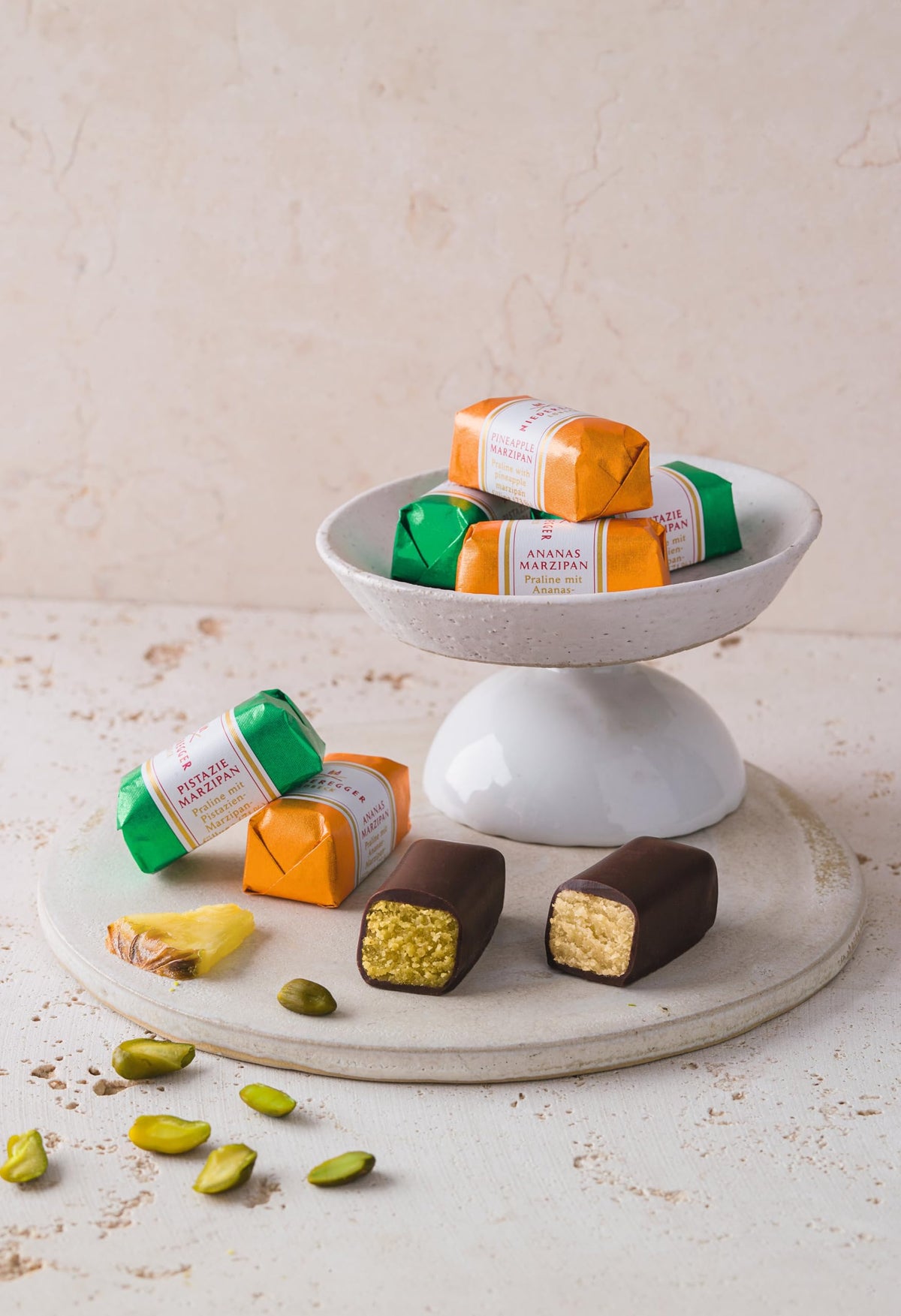 Niederegger orange marzipan with milk chocolate delivering bright, citrusy sweetness.