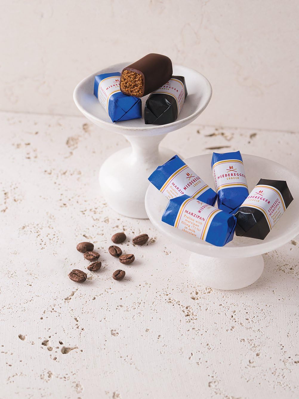 Niederegger pistachio marzipan enrobed in dark chocolate offers nutty richness.