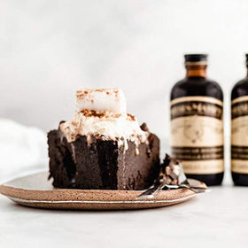 Nielsen-Massey Madagascar vanilla beans with bottle scene, sensory anticipation of flavor.