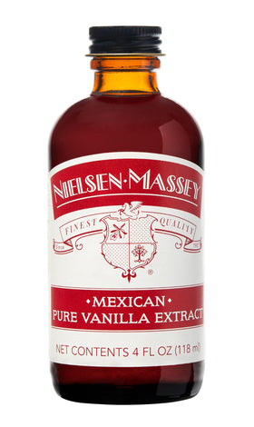 Nielsen-Massey Mexican Vanilla Extract bottle pours rich vanilla for desserts.