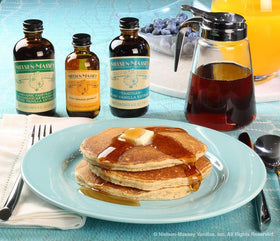 Kitchen setup with Nielsen-Massey Orange Extract for citrus-forward sauces