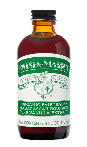 Nielsen-Massey Organic Madagascar Vanilla Extract bottle pour, capturing rich, multi-note flavor for baking.