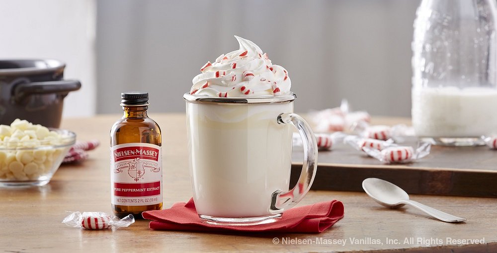 Bottle being poured to flavor a dessert with vibrant peppermint notes.
