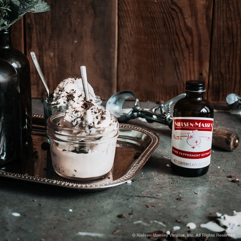 Kitchen scene featuring the bottle alongside premium ingredients and tools.