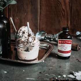 Kitchen scene featuring the bottle alongside premium ingredients and tools.