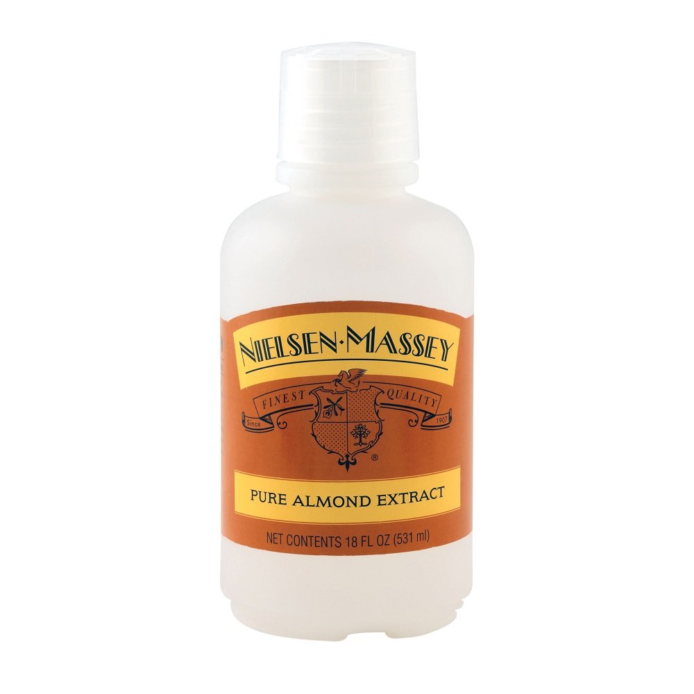 Nielsen-Massey almond extract bottle pour shows versatility for desserts and dressings