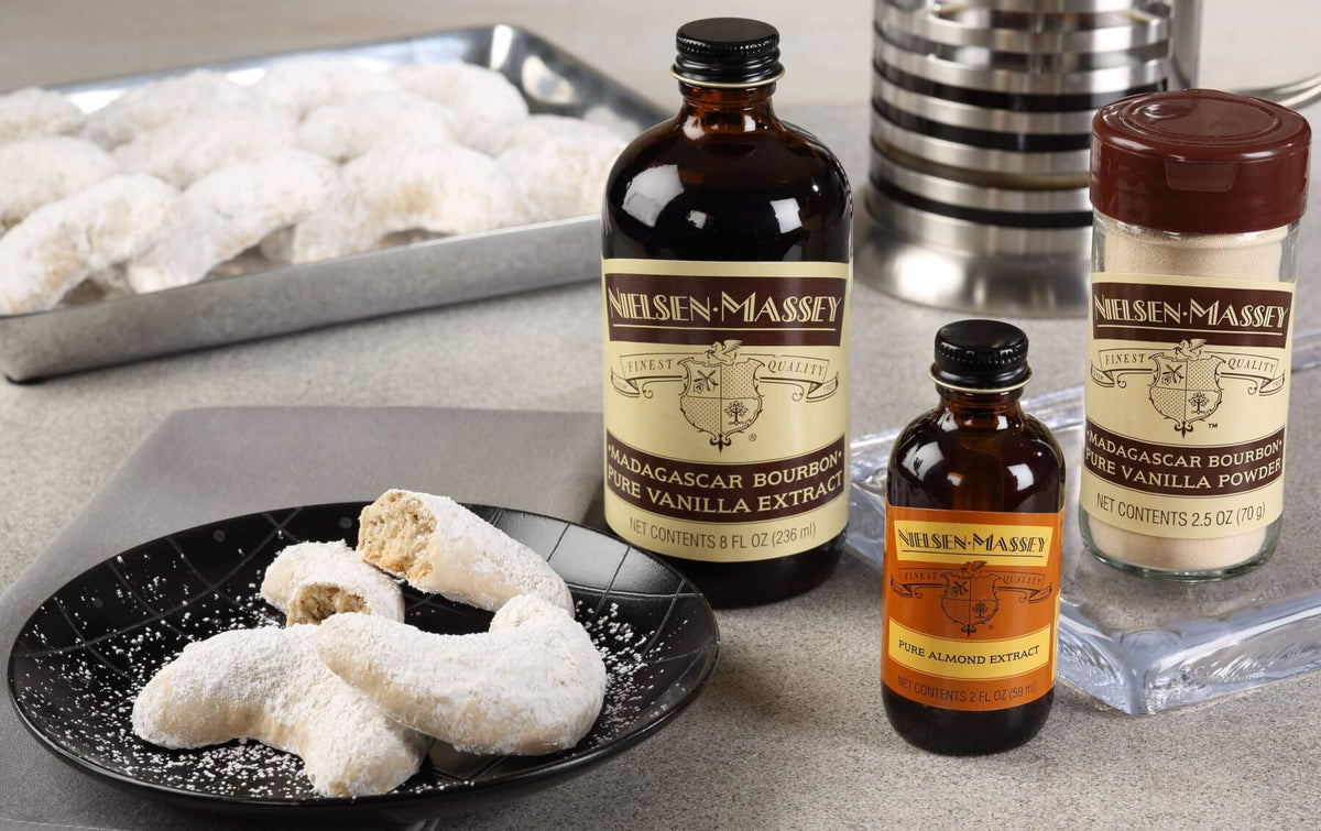 Nielsen-Massey almond extract glass bottle and label suggests premium pantry staple
