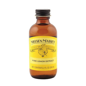 Nielsen-Massey Pure Lemon Extract bottle pour for quick lemon flavor in desserts.