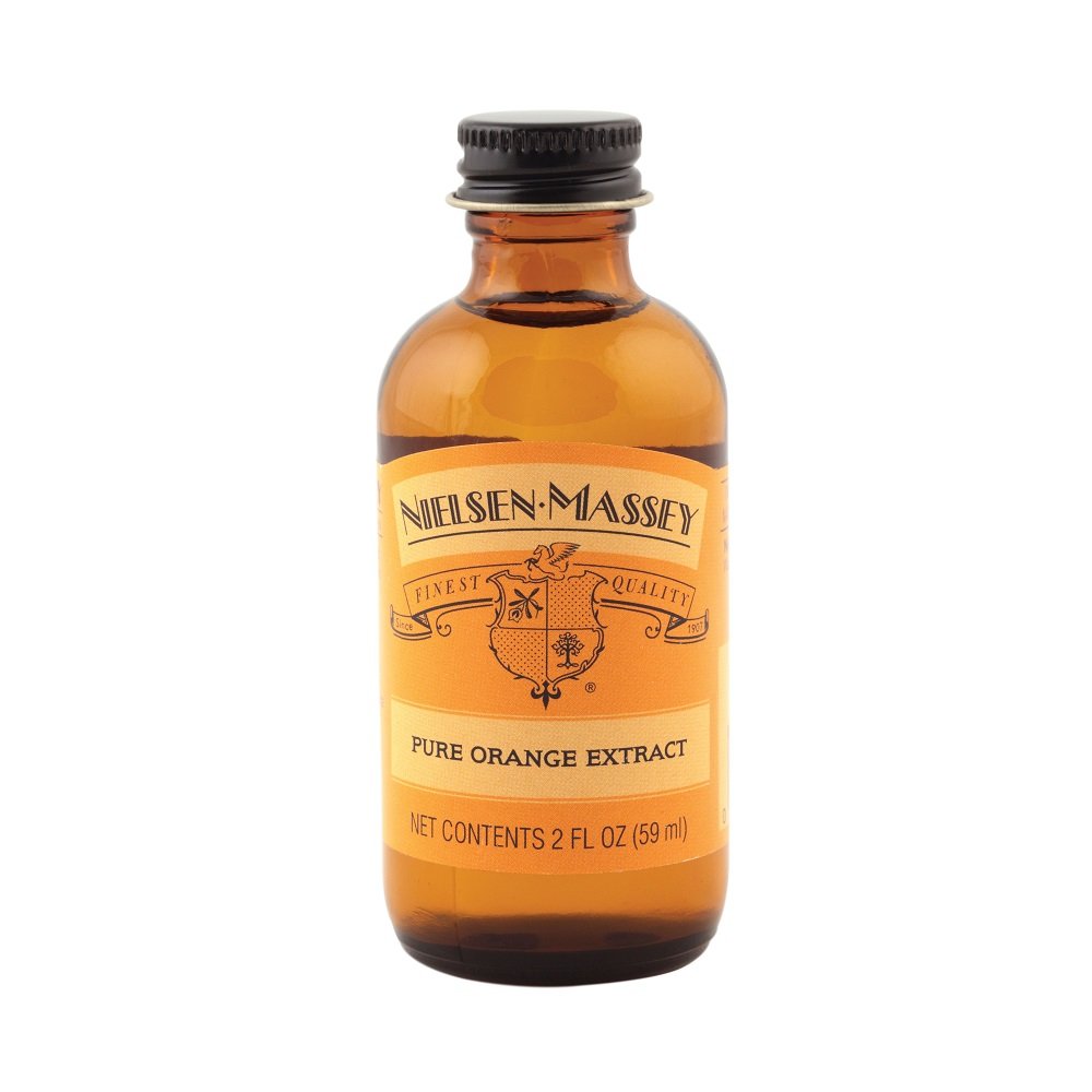 Pour of Nielsen-Massey Orange Extract adding bright citrus flavor