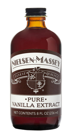Nielsen-Massey Pure Vanilla Extract bottle close-up, premium flavor for baking.