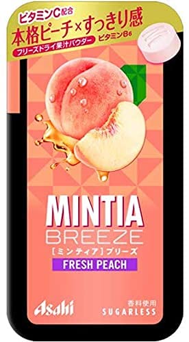 Open Mintia Breeze peach tablets showing large-grain mint and peach flavor