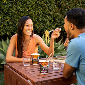 Nissin Cup Noodles Stir Fry Fiery Chicken ingredients spread shows green beans and cabbage.