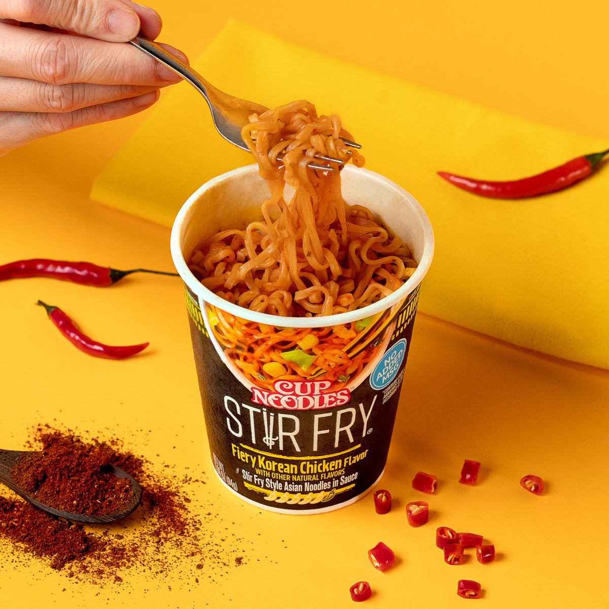 Nissin Cup Noodles Stir Fry Fiery Chicken pack-shot for on-the-go meals.