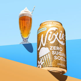 Nixie Sparkling pour into a glass shows crisp bubbles and refreshing finish.