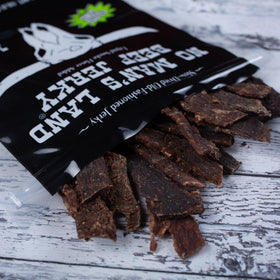 No Mans Land Beef Jerky fajita lime marination bowl highlighting bold flavor infusion.