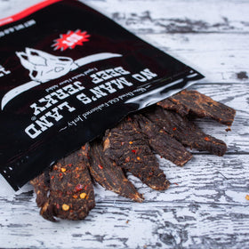 No Mans Land hand-trimmed beef jerky segment—premium quality.