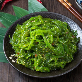 Noble Createaprototype seaweed salad sesame dressing drizzle hints at savory richness.