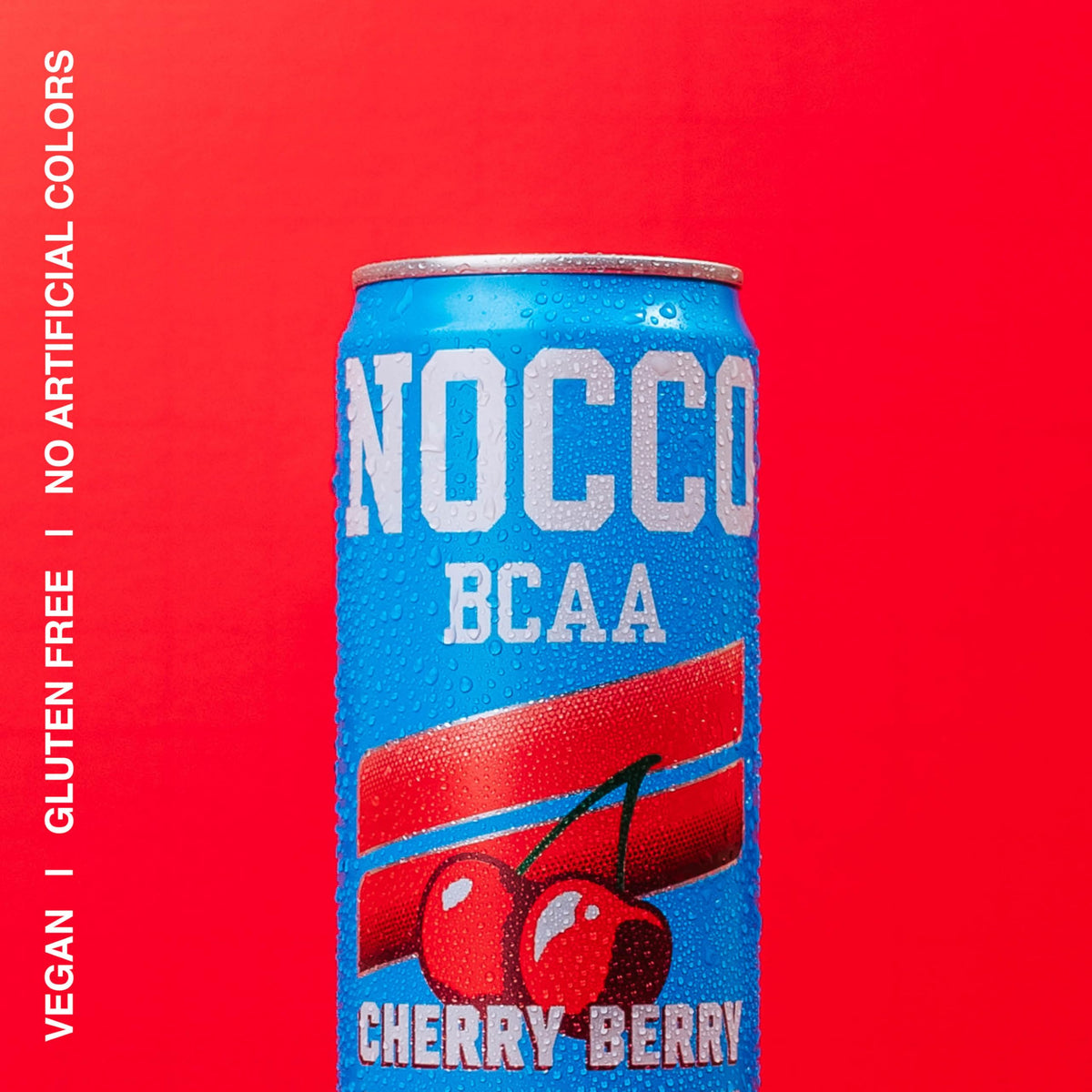 Pouring NOCCO Cherry Berry into glass showing carbonation