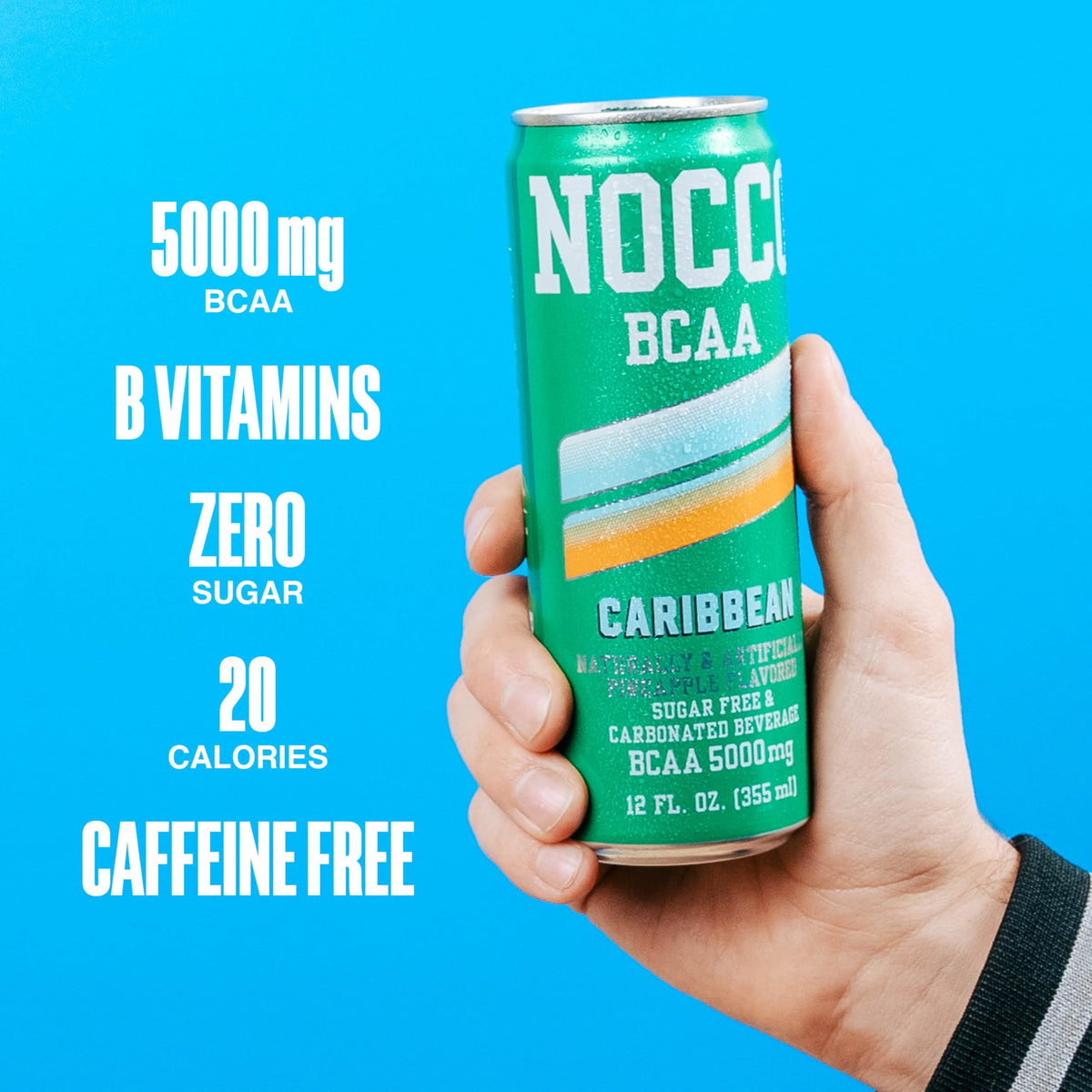 Athlete holding NOCCO BCAA can after training.