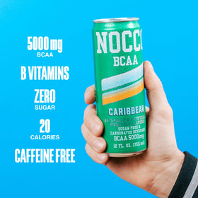 Athlete holding NOCCO BCAA can after training.