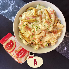 Nola mayonnaise packaging closeup emphasizes imported quality from South Africa.