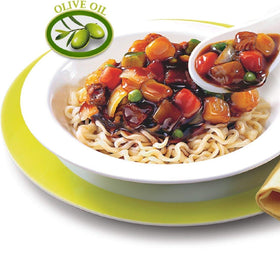 Nongshim Chapagetti noodles in a bowl ready to savor with rich black bean sauce.