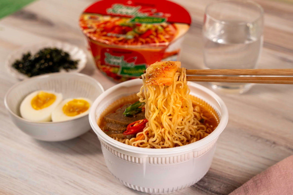 Nongshim microwave-ready ramen showing steaming noodles and rich sauce.