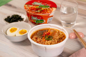 Nongshim-packaged ramen bowl in a 12-pack, stackable storage.